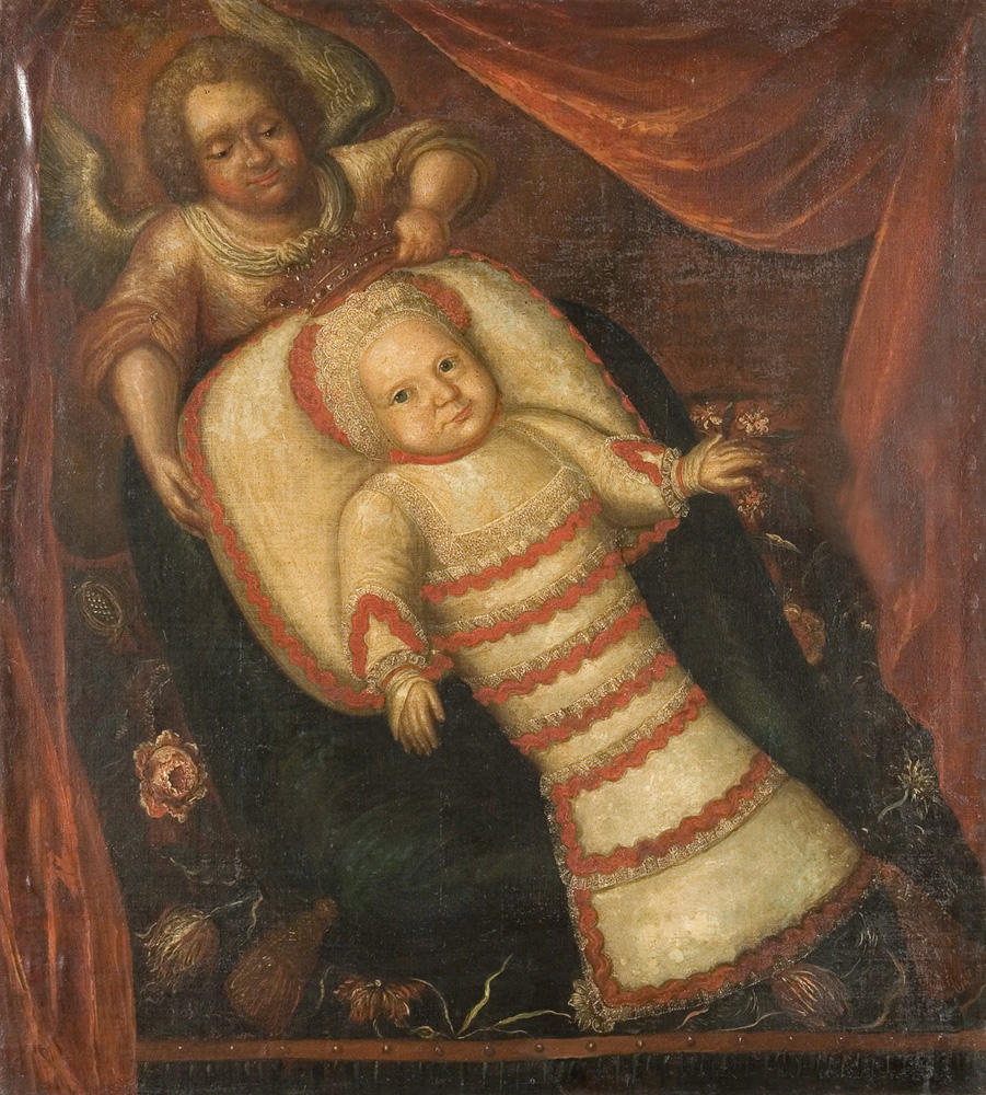 Anioł Stróż trzyma korobę nad dzieckiem w ozdobnym beciku t